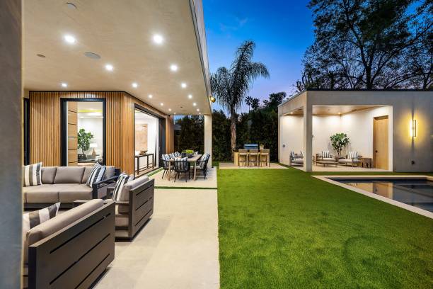 istock Modern outdoor patio with seating and dining area at twilight. 2175972301