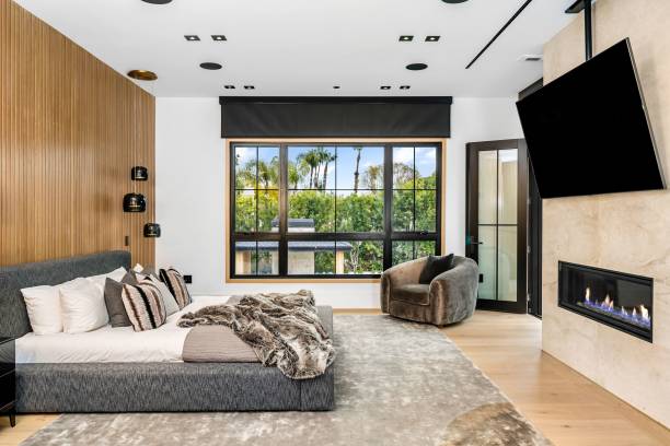 istock Modern bedroom with fireplace and large window 2175972307