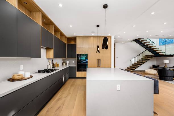 istock Modern kitchen interior with sleek black and wooden cabinets. 2175972327