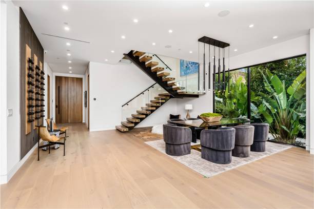 istock Modern interior with sleek staircase and dining area 2175972330