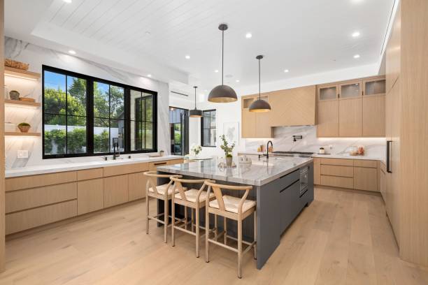 istock Modern kitchen with wooden cabinets and large island 2175972348