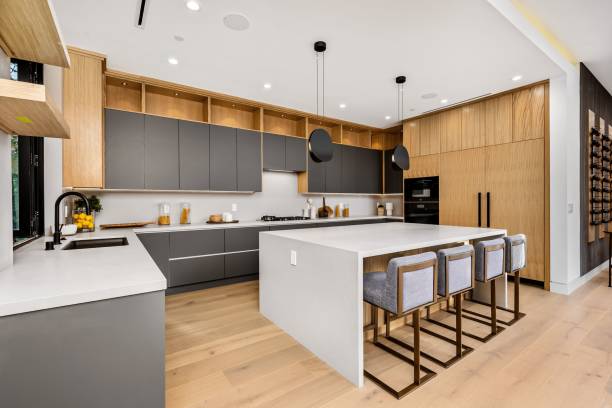 istock Modern kitchen interior with a large island and sleek cabinetry. 2175972353