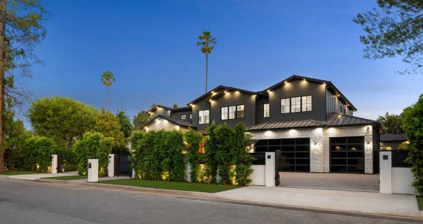 istock Modern luxury home with garden and driveway. 2175972362