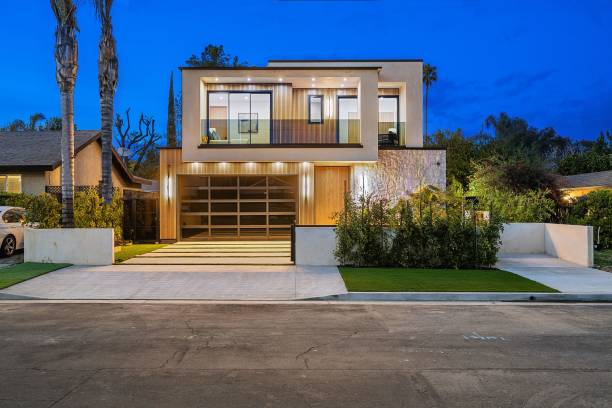 istock Modern two-story house at dusk 2175972411