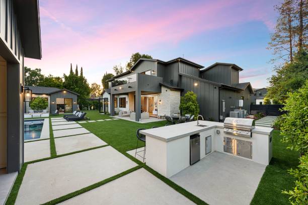 istock Modern backyard with outdoor kitchen and pool at sunset. 2175972463