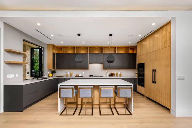 istock Modern kitchen with wooden cabinets and island. 2175972475