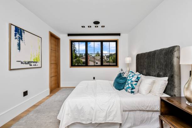 istock Modern bedroom with large window and stylish decor 2175972491