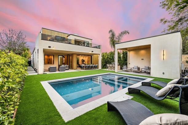 istock Modern luxury home with pool and garden at sunset. 2175972545