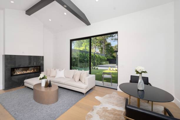 istock Modern living room with fireplace and backyard view 2175972557