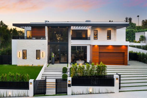 istock Modern luxury house with large windows and manicured lawn. 2175972576