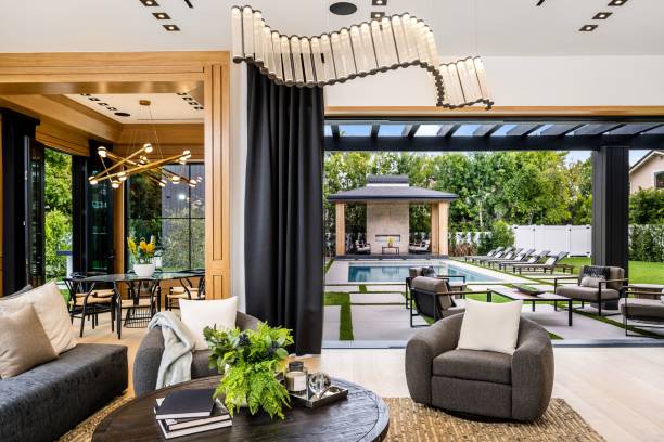 istock Modern living room with pool view and stylish decor. 2175972584