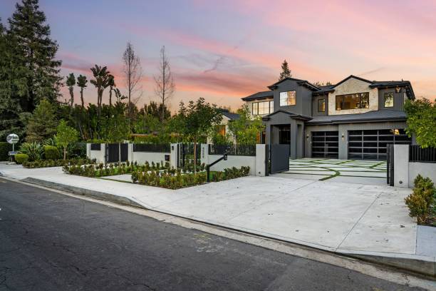 istock Modern luxury home with manicured front yard at sunset. 2175972587