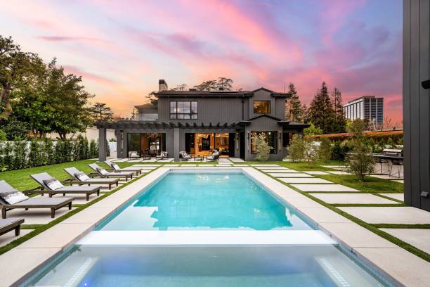 istock Luxurious modern house with a swimming pool at sunset 2175972646