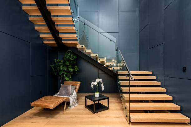 istock Modern interior with wooden floating staircase and glass railing. 2175972746