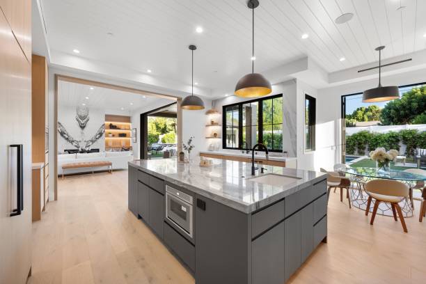 istock Modern open-concept kitchen with large island and backyard view. 2175972749