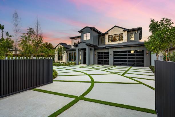 istock Modern house with designed driveway at sunset 2175972769