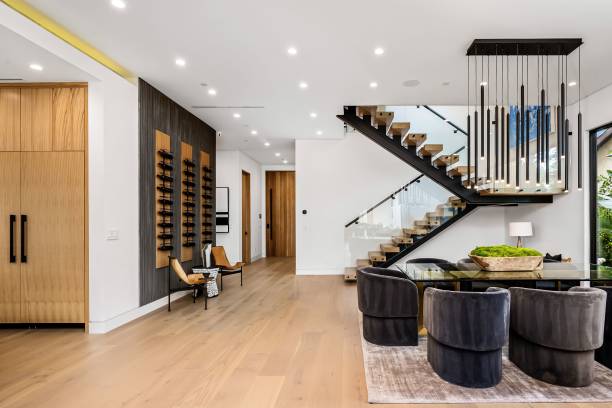 istock Modern open-concept living and dining area with stylish staircase. 2175972778