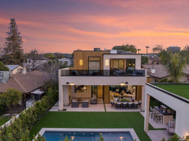 istock Modern two-story house with pool at sunset 2175972784
