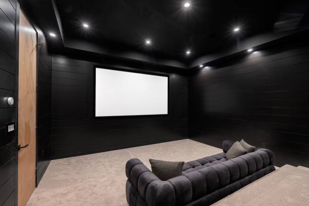 istock Modern home theater room with large screen and seating 2175972809