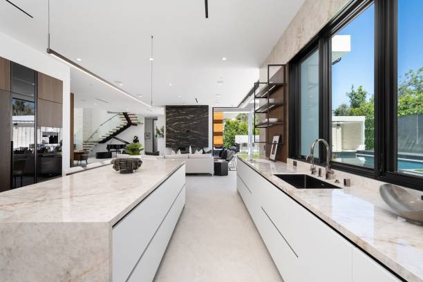 istock Modern kitchen interior with marble countertops and large windows 2175972827