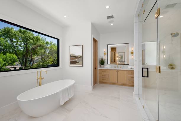 istock Modern bathroom with freestanding bathtub and large window. 2175972832