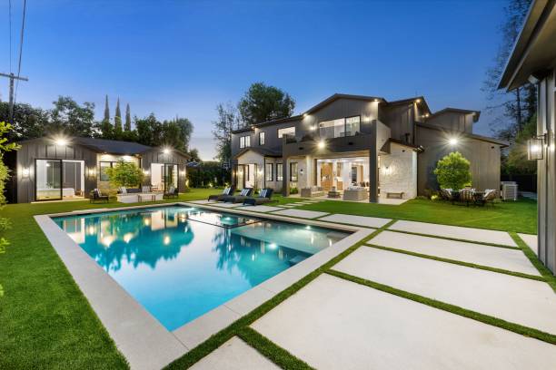 istock Modern luxury home with swimming pool and backyard at dusk. 2175972857