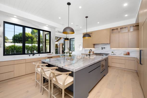 istock Modern kitchen with marble countertops and wooden cabinets. 2175972951