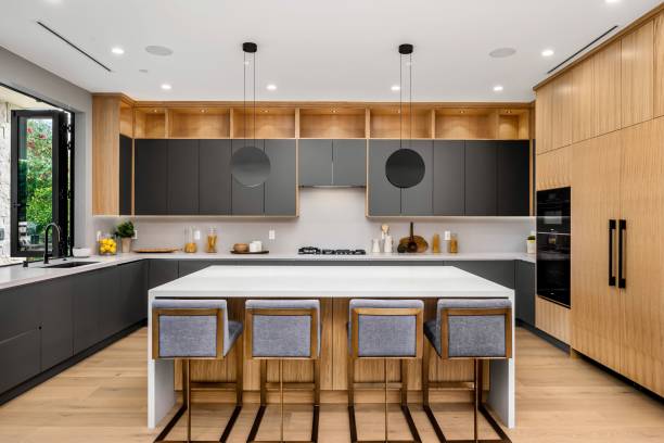 istock Modern kitchen with wooden cabinets and central island. 2175973052