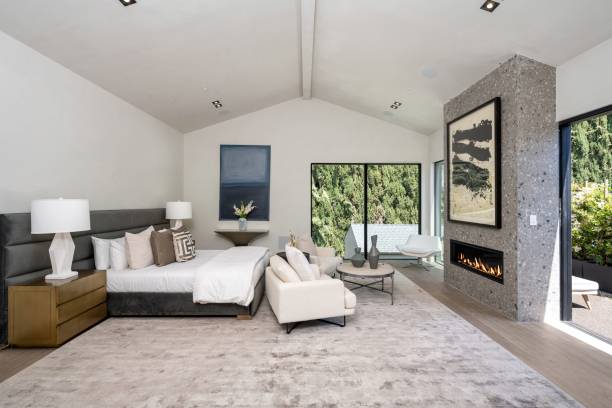 istock Modern bedroom with fireplace and large windows 2175973637