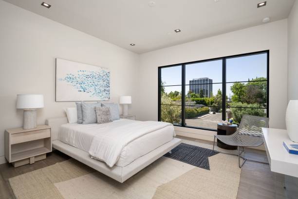 istock Modern bedroom with large window and city view 2175973643