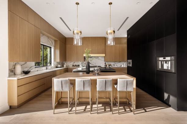 istock Modern kitchen with wooden cabinets and marble countertops. 2175974269