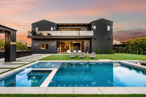 istock Modern luxury house with swimming pool at sunset 2175974270