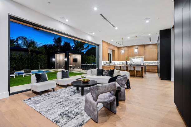 istock Modern open-concept living room and kitchen with backyard view 2175974281