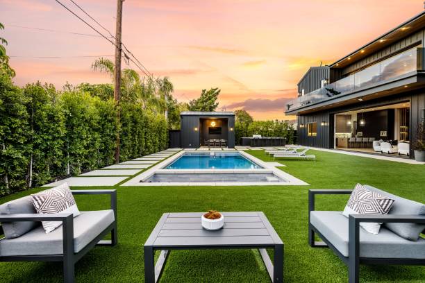 istock Modern backyard with pool and seating area at sunset. 2175974319