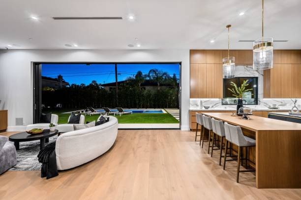 istock Modern open-concept living room and kitchen with pool view. 2175974339