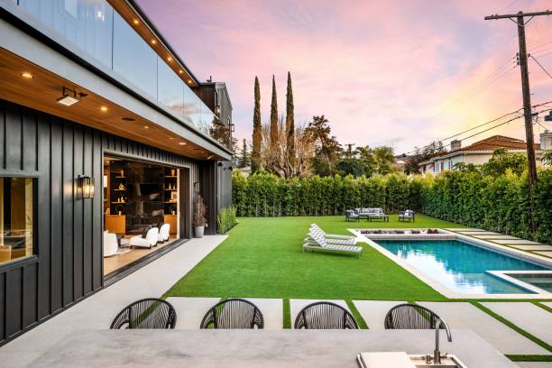 istock Modern backyard with pool and seating at sunset. 2175974340