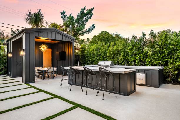 istock Modern outdoor kitchen and dining area at sunset. 2175974365