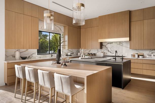 istock Modern kitchen with wooden cabinets and marble countertops. 2175974380