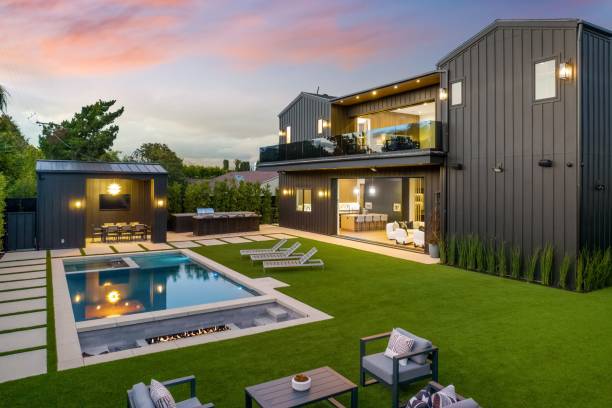 istock Modern luxury home with pool and lounge area at sunset. 2175974384