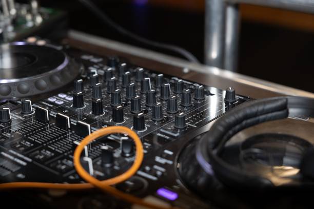 istock DJ mixer with headphones and cables 2175974459