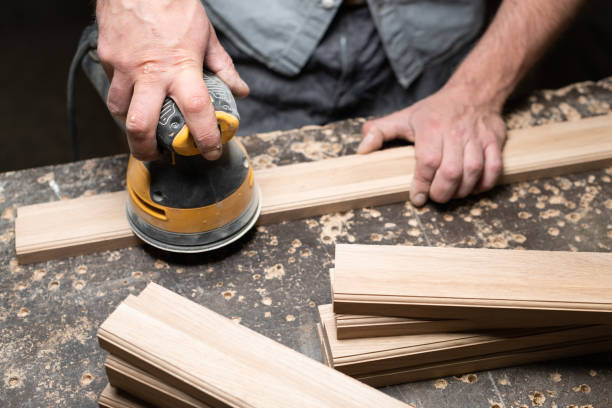 istock A carpenter grinds an oak part with a grinding machine 2175974473