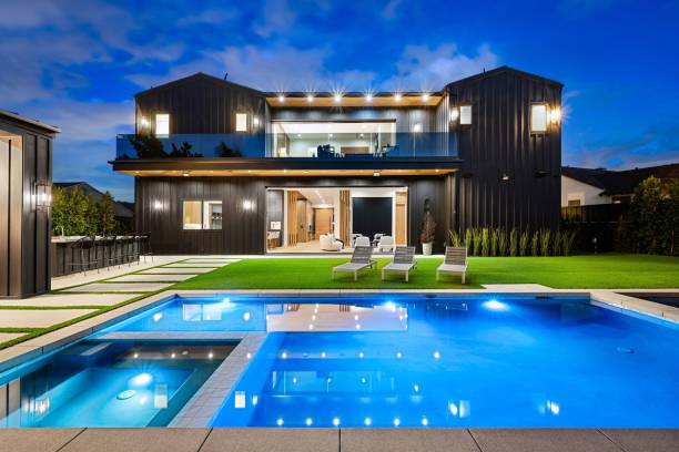 istock Modern luxury home with swimming pool at dusk 2175974474