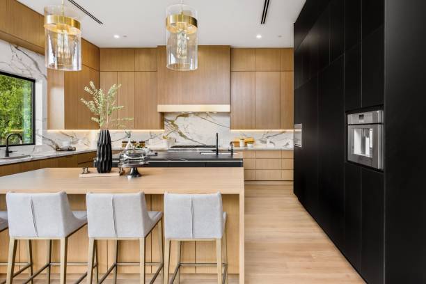 istock Modern kitchen interior with wooden cabinets and marble countertops. 2175974522
