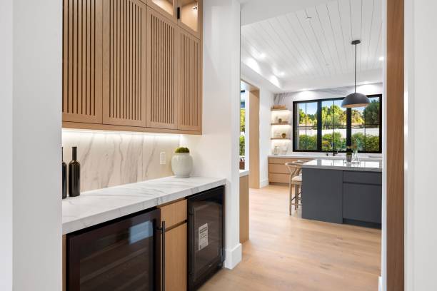 istock Modern kitchen with wooden cabinets and marble countertops. 2175974696