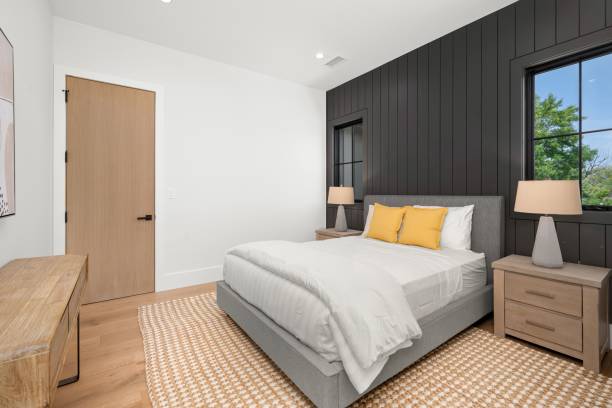 istock Modern bedroom with grey bed and yellow pillows 2175974756