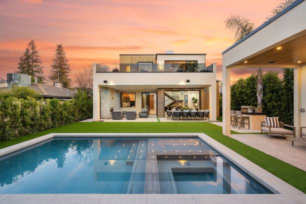 istock Modern luxury home with swimming pool at sunset 2175974760
