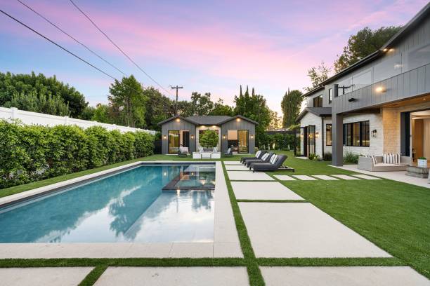 istock Modern backyard with pool and guest house at sunset 2175974773