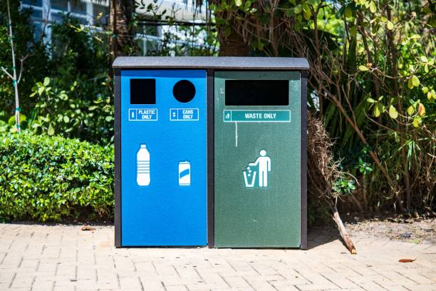 istock Recycling bins for plastic, cans, and waste in a park. 2175975134