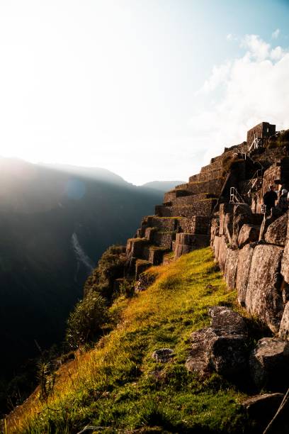 istock Machu Picchu at sunset with terraced stone structures. 2175975214
