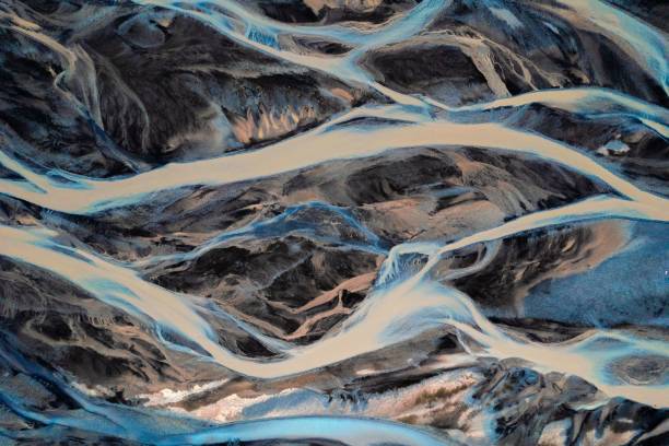 istock Aerial view of braided river patterns in a glacial landscape. 2175975581